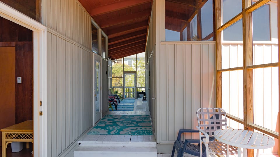 Breezeway looking North.  Bedroom 2 on left.  Door to Bedroom 3 up steps on left