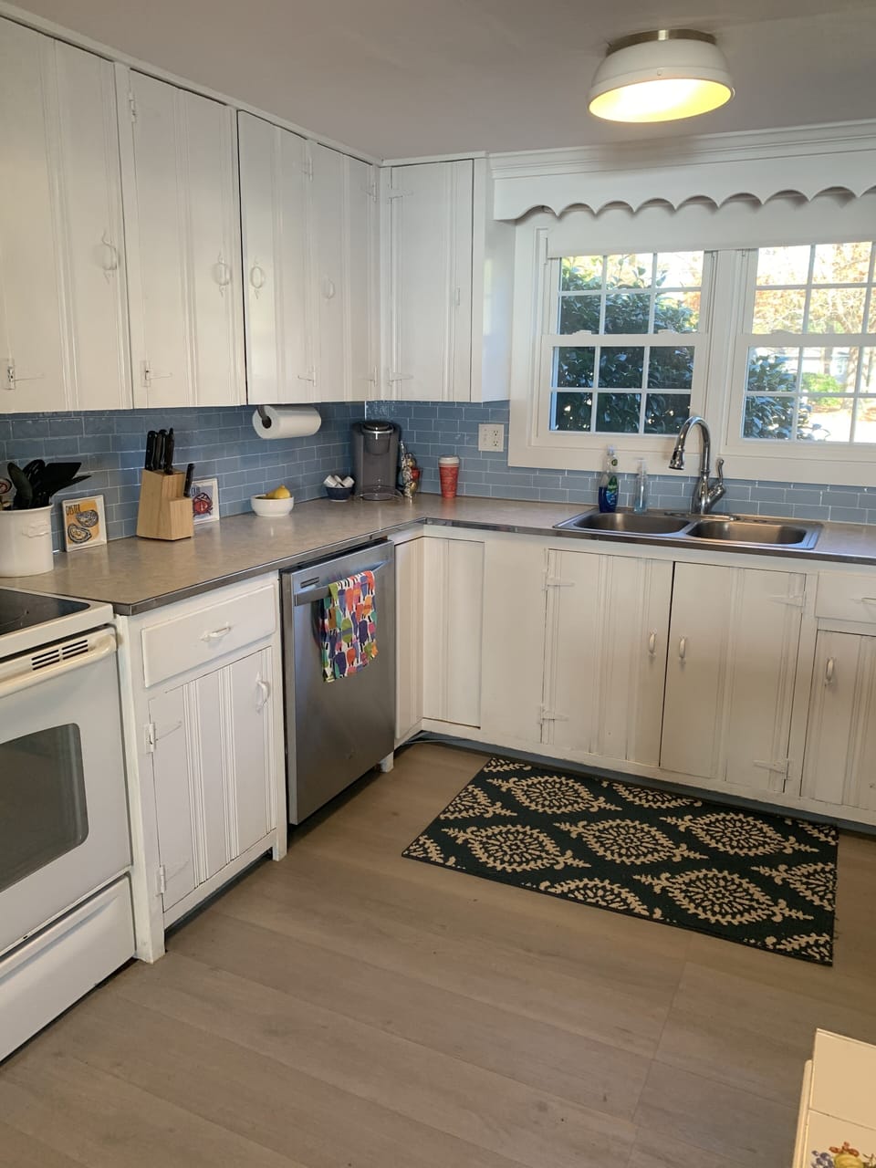 Fully equipped kitchen with Keurig and coffee pot, blender, toaster, and more