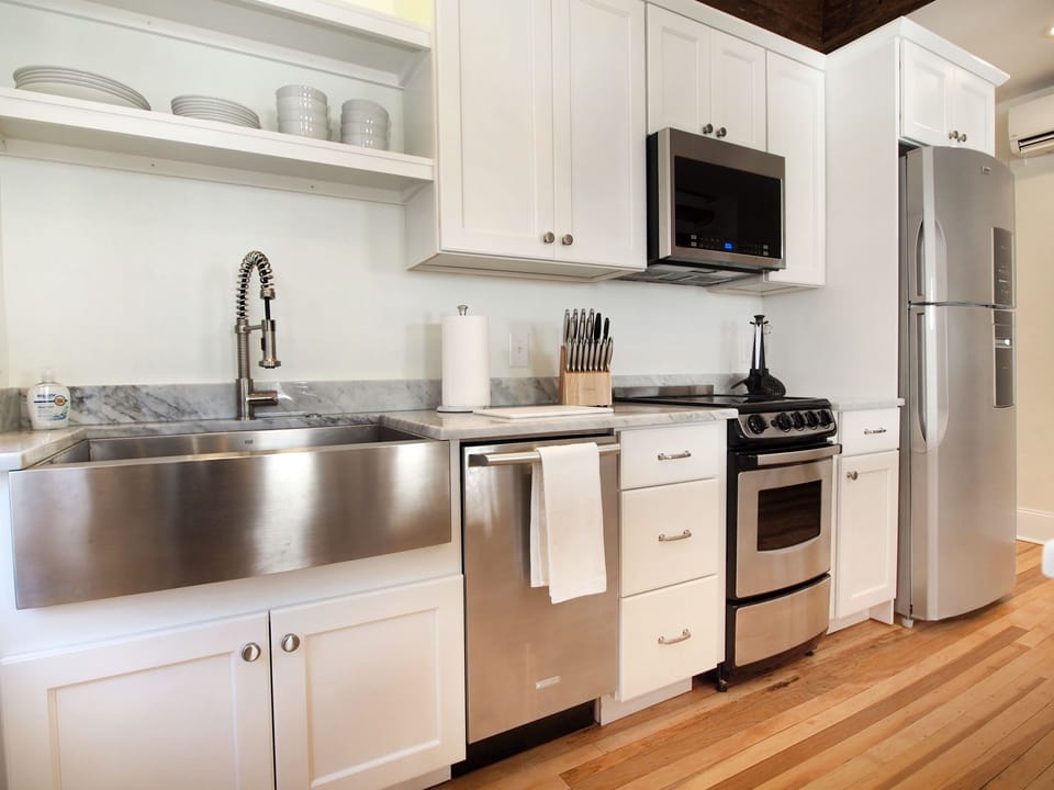 Modern, fully-equipped kitchen featuring stainless steel appliances