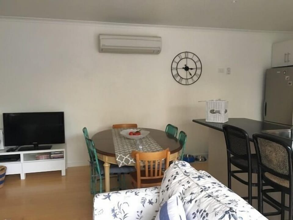 Dining table in open plan living room.
