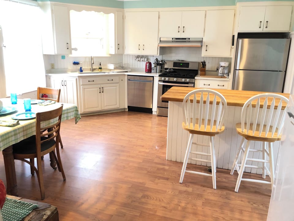 Eat in Kitchen seats 8 plus 2 more at the butcher block Island.
