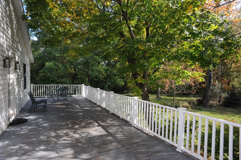Large private deck with view of gardens and woods