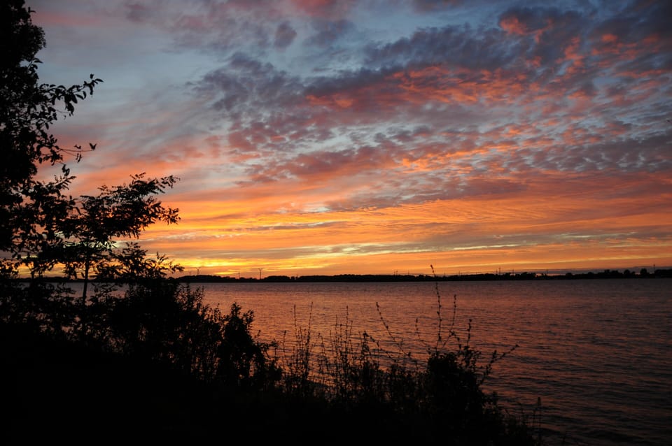 View of warm summer sunset from the waterfront
bank of the St. Lawrence.