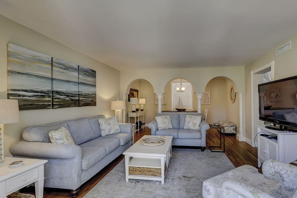 Living room - Living area with beautiful arches into dining area.