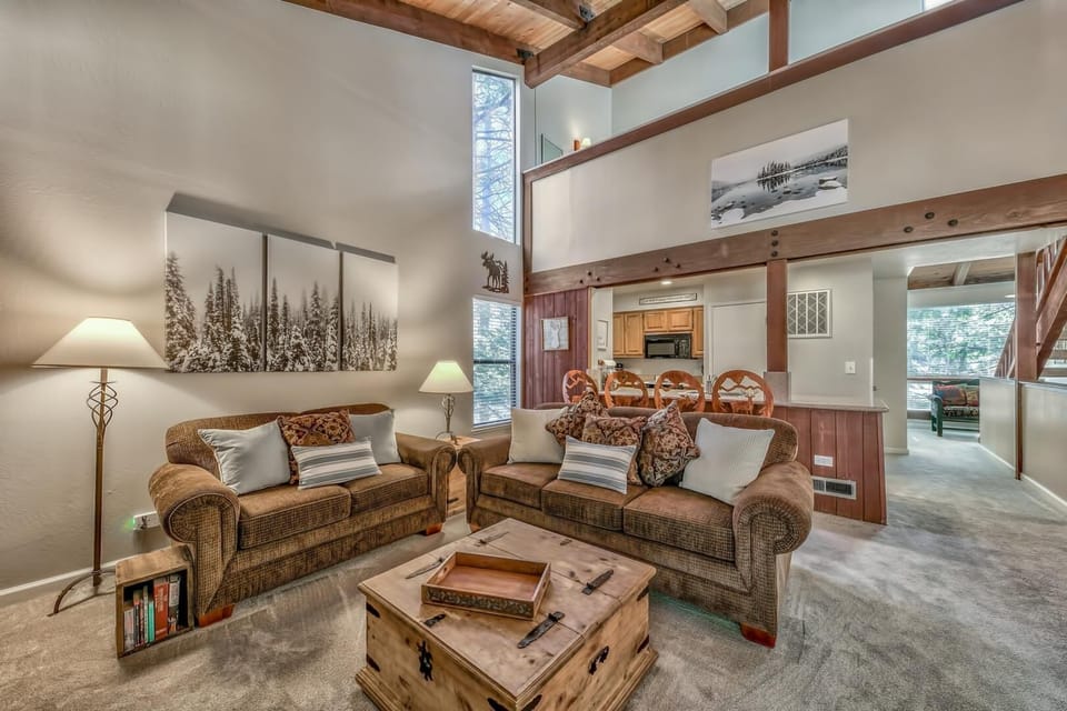 The vaulted ceilings and large picture windows let in incredible natural light to this open-concept living space