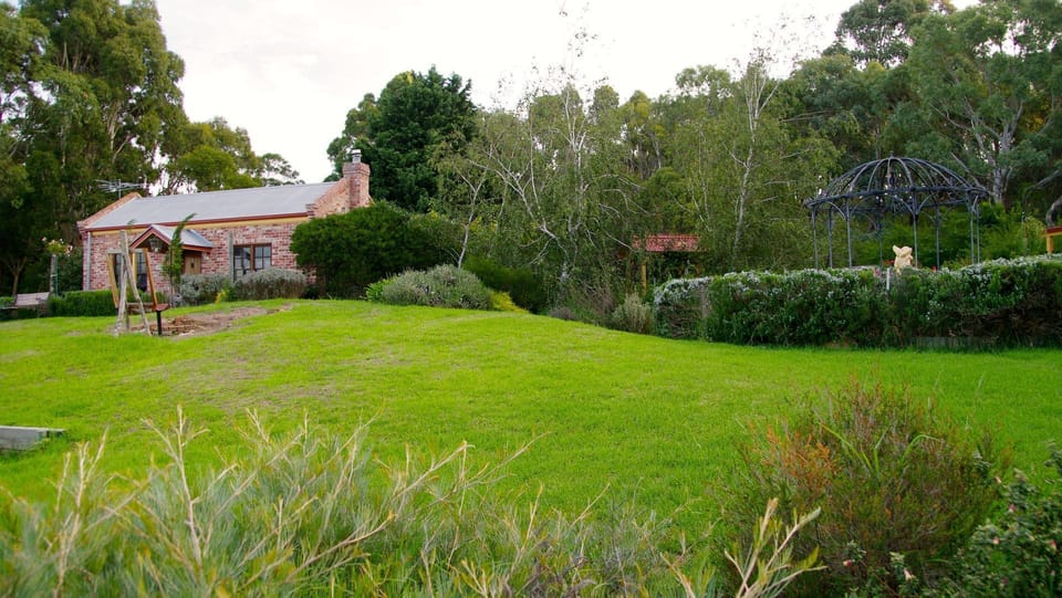 Your cottage set in the garden facing the panoramic views over Inman Valley 