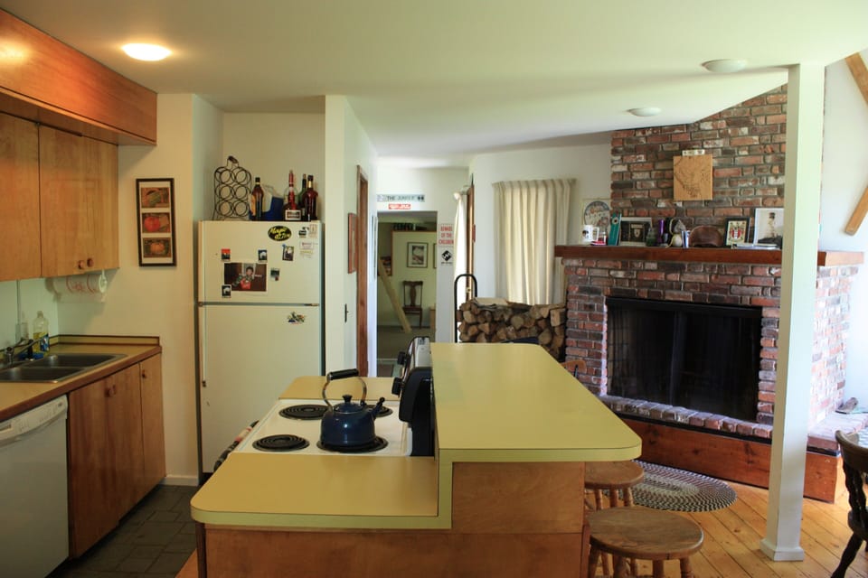 Kitchen with working fireplace.  Great spot to hang out after biking/skiing!