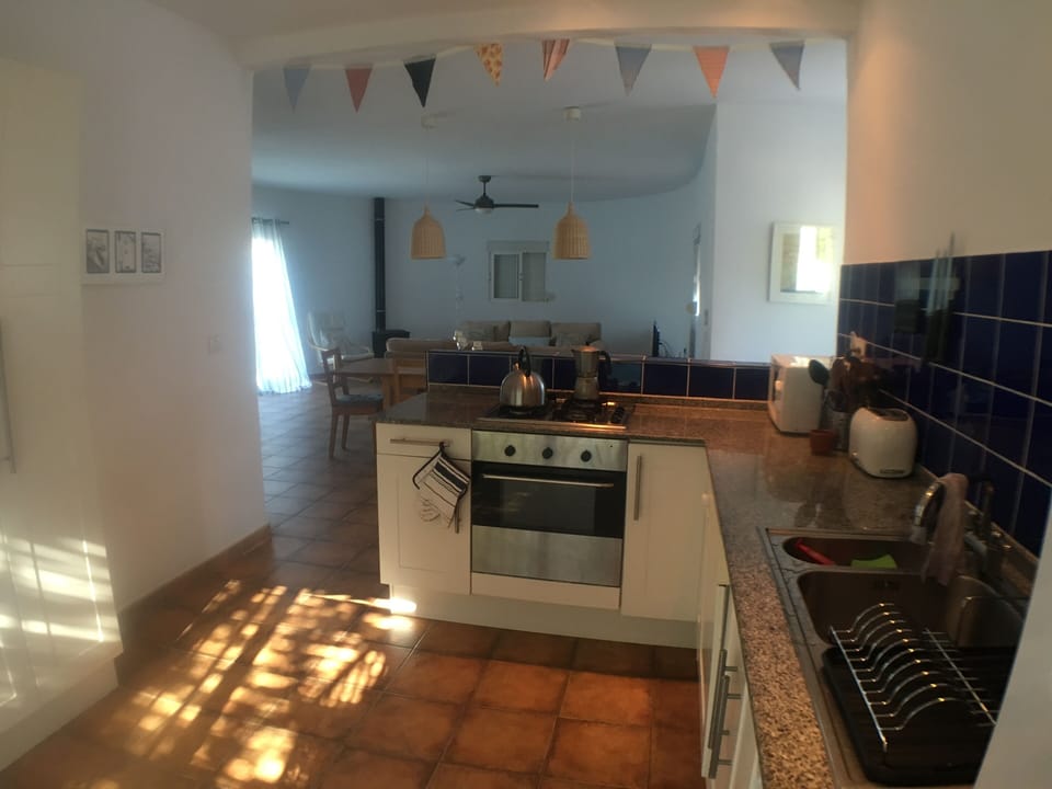 The kitchen and living area beyond at Casa Curvada