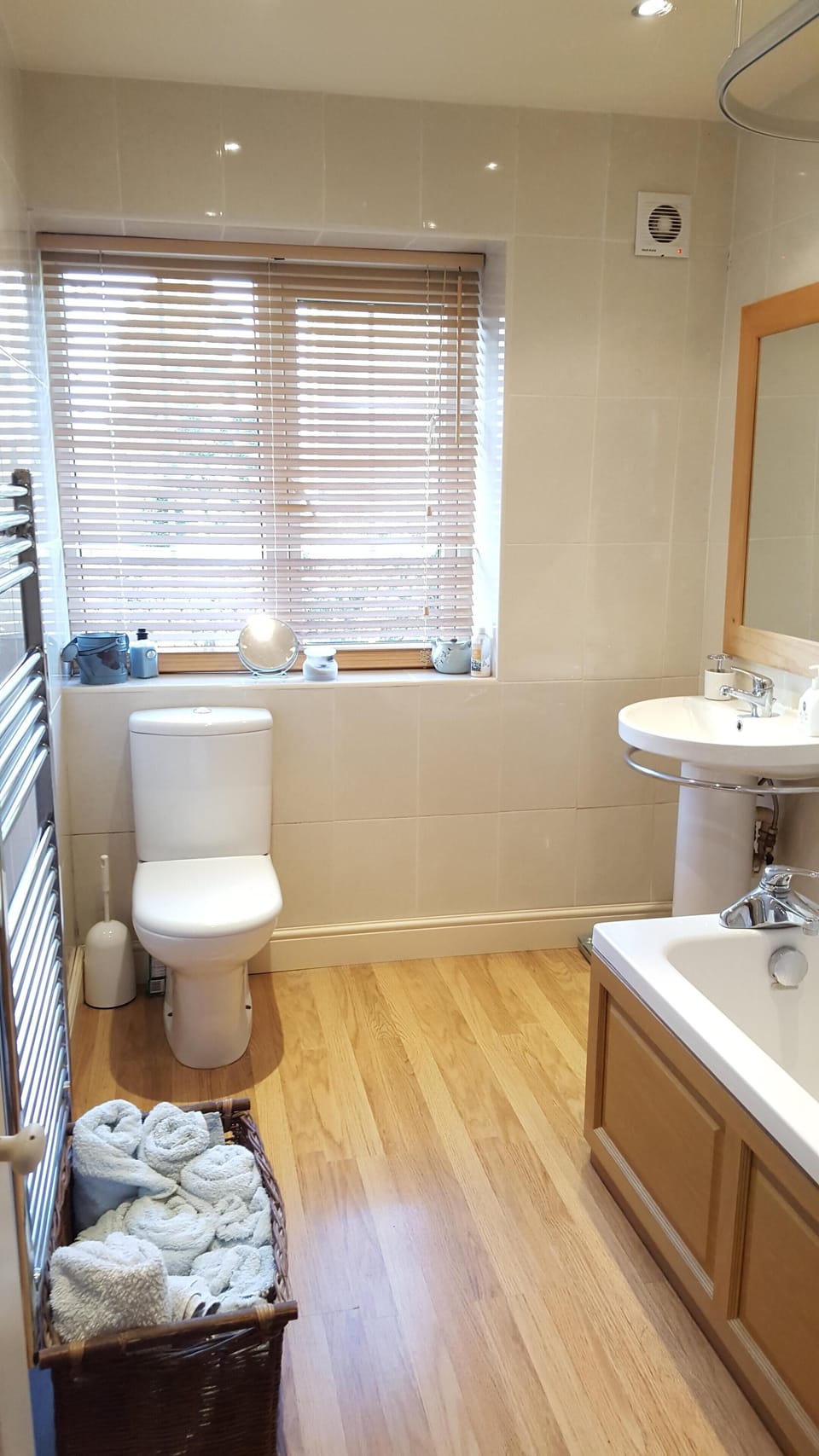 Bathroom with electric shower over bath