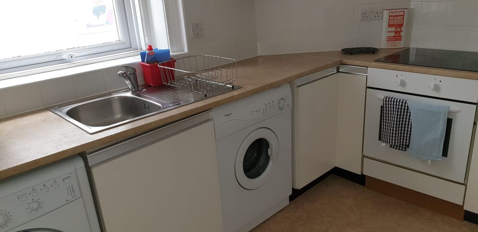 Putney kitchen with washer and dryer