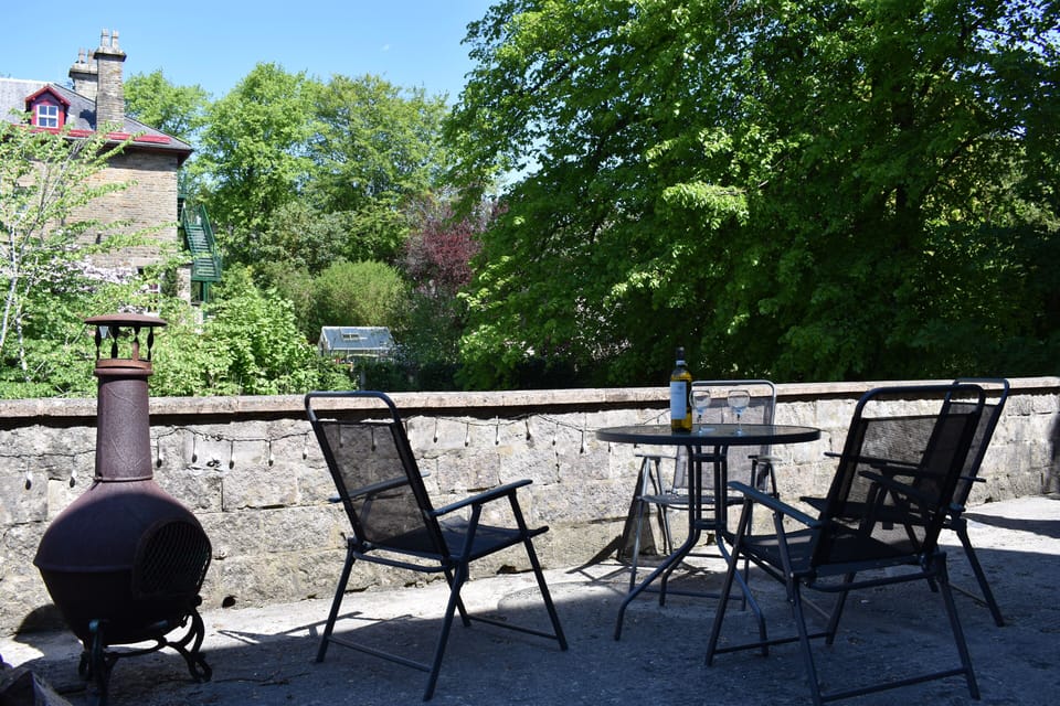 Outdoor seating area offering pleasant views of greenery and gardens