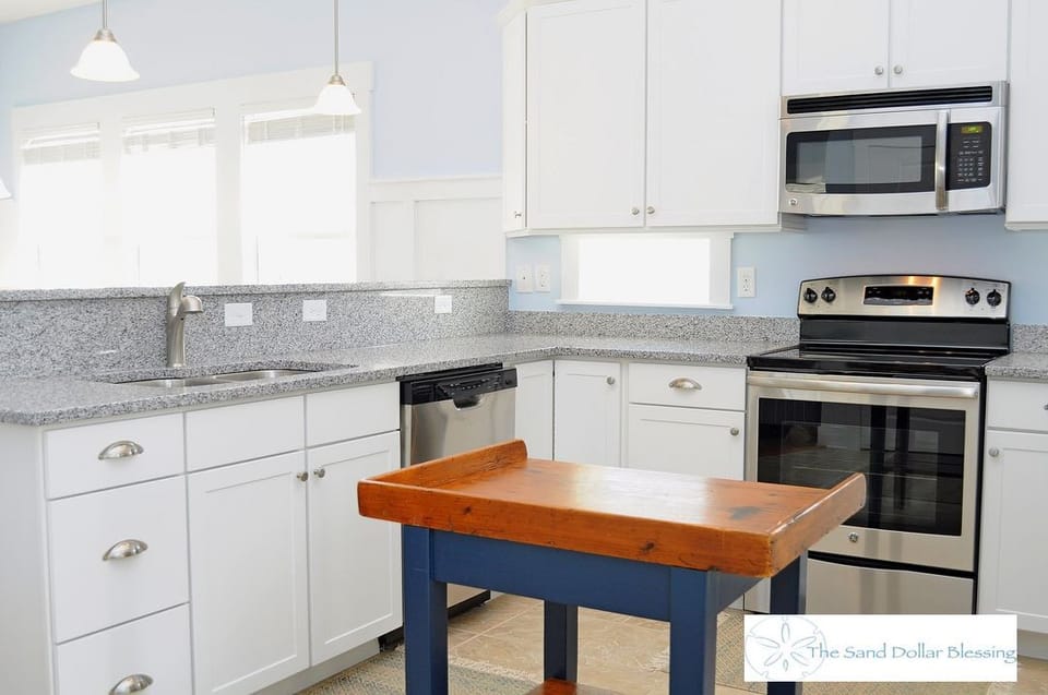 Lots of windows and work space in the kitchen - along with a dishwasher!