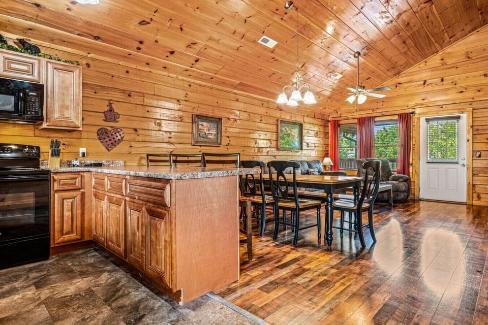 From the kitchen to the living room, enjoy the beauty of this cozy log cabin!