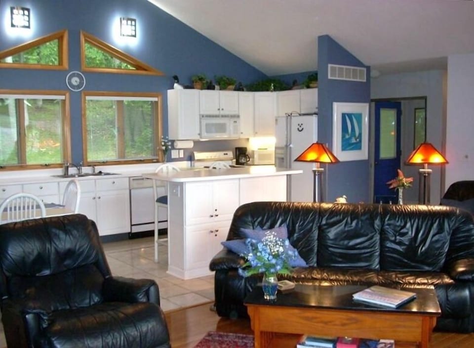 Great Room features a cathedral ceiling w/  an island that seats six 