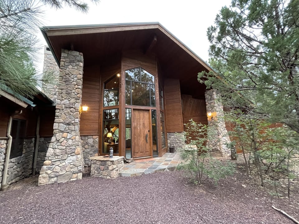 Front door of cabin, two car garage to left not seen in photo.