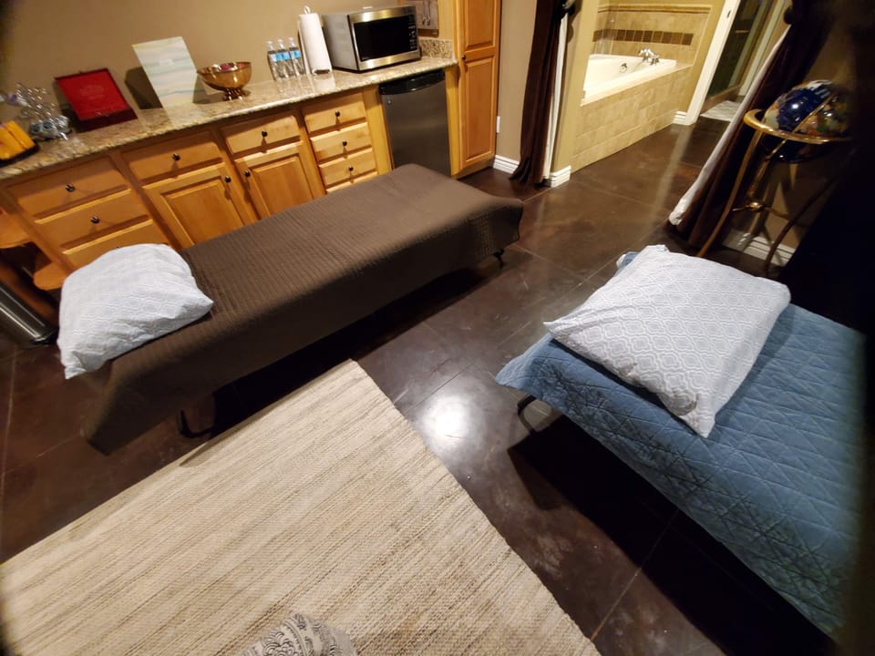 two twin cots with memory foam mattresses