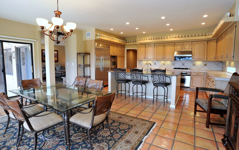 Spacious Kitchen and Dining Area, sliding glass doors lead to exterior patio