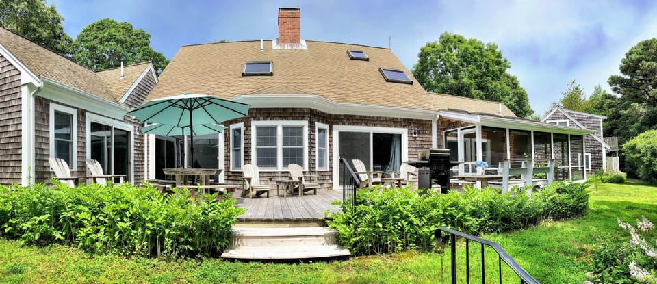The back porch.Primary bedroom on the left, screened-in-porch on the right.