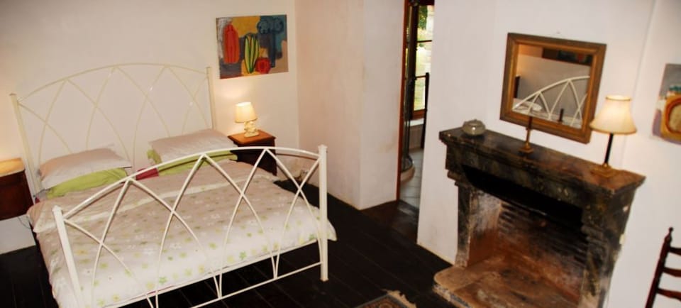 Downstairs bedroom with super kingsize bed and en-suite bathroom