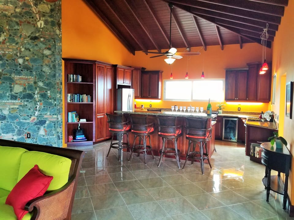 The fully equipped gourmet kitchen with custom mahogany cabinets