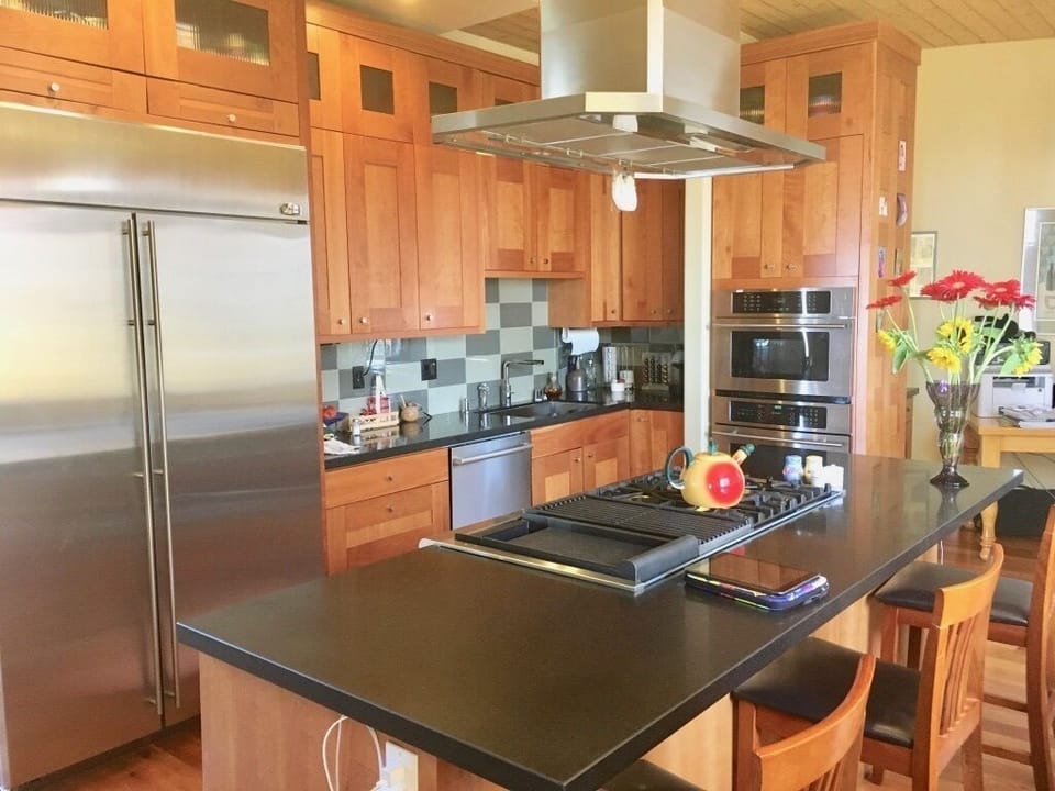 Gourmet kitchen with granite counters, cherry cabinets