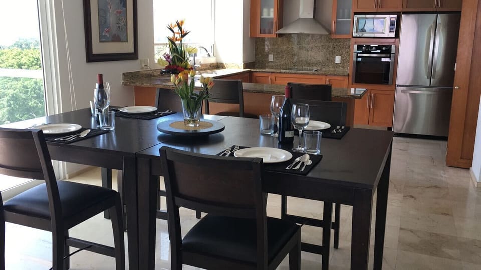 DINING ROOM & KITCHEN - RELAX & ENJOY YOUR MEALS INSIDE OR ON THE CONDO BALCONY
