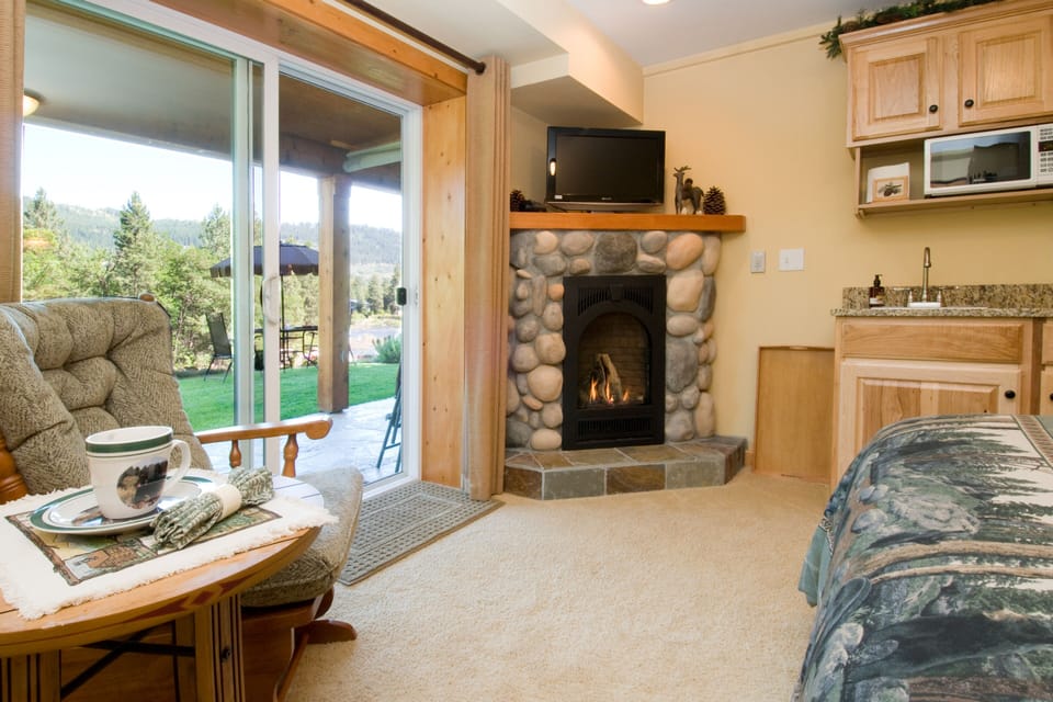River rock gas fireplace and private patio