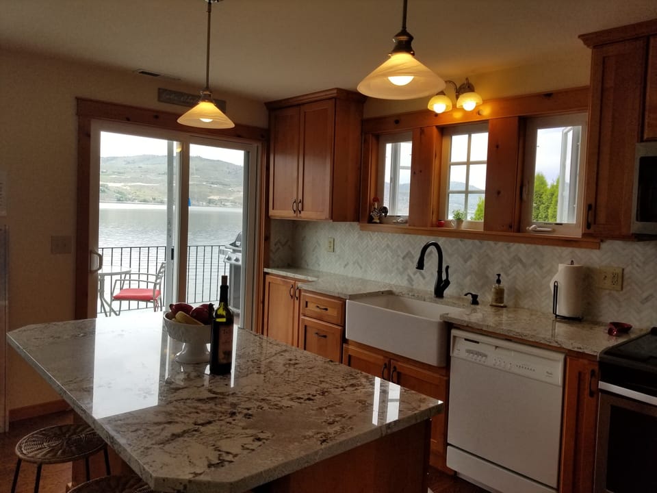 Newly remodeled kitchen has direct access to the waterfront deck. Great views!
