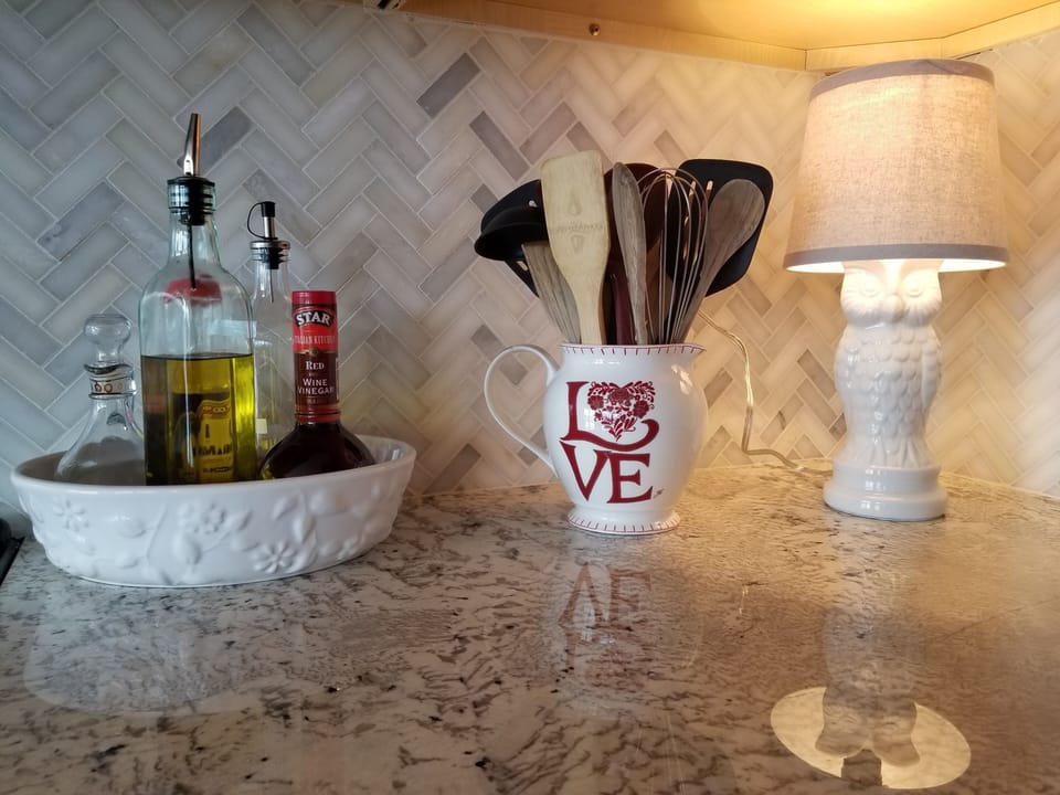 Kitchen is fully stocked, including a large variety of spices and oils. 