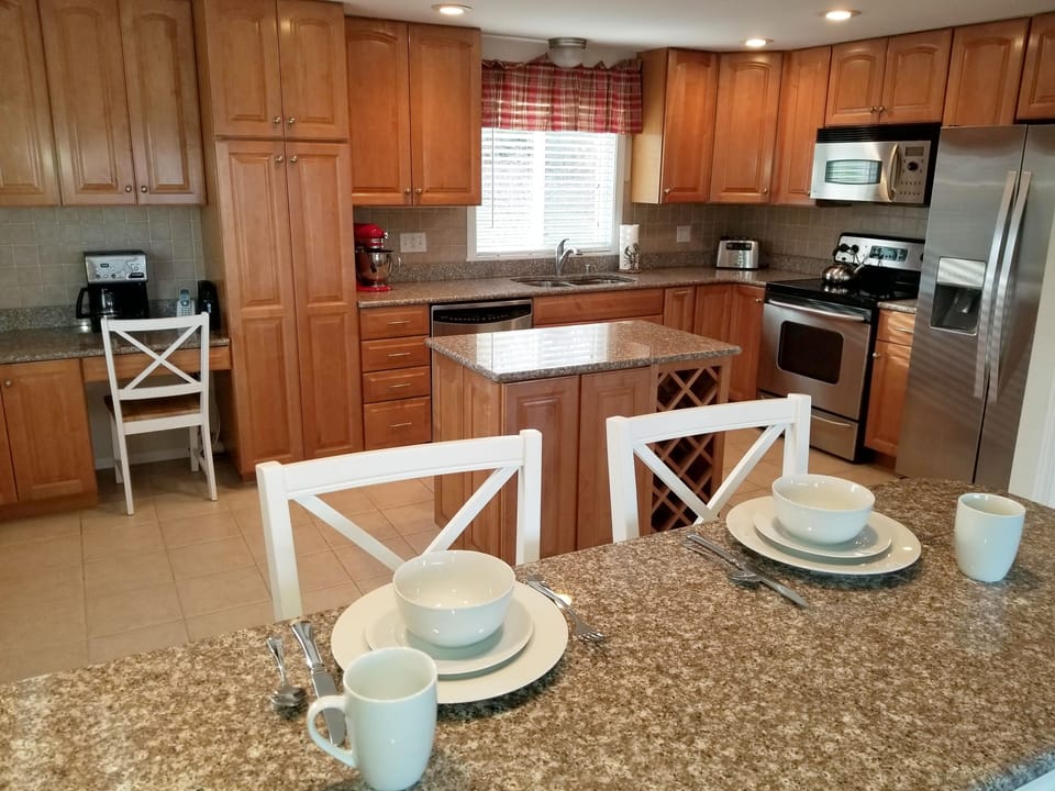 Beautiful upgraded kitchen with stainless steel appliances and granite counters.