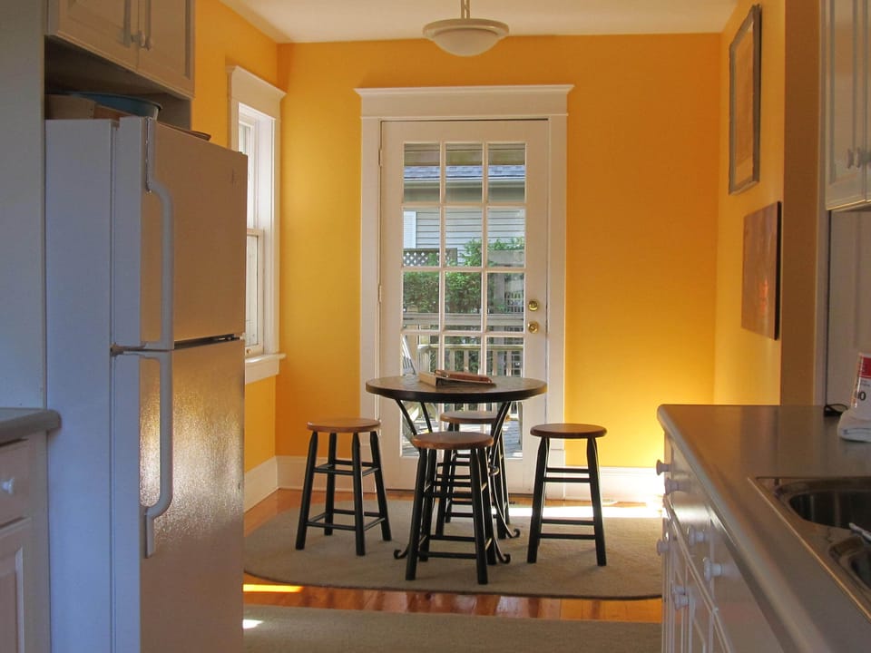 The breakfast area and door to side deck and garden