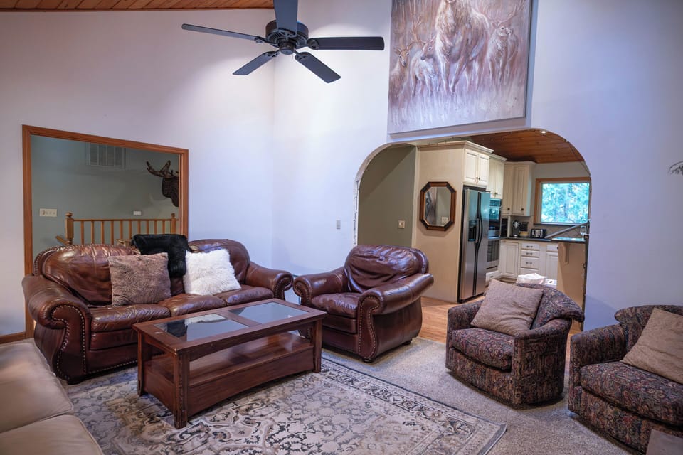 Upper living room looking towards kitchen and stairs.
