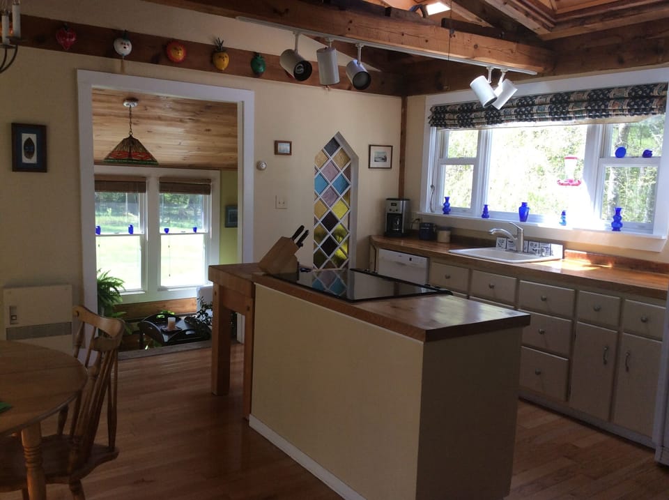 Kitchen and dining area opening into solarium