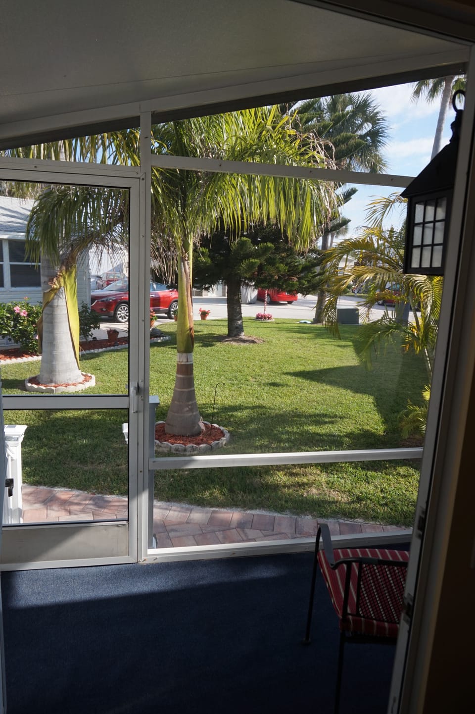Screened porch and view of backyard