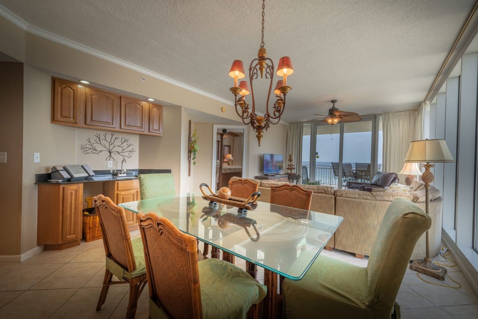 Dining room and view of living room and wet bar