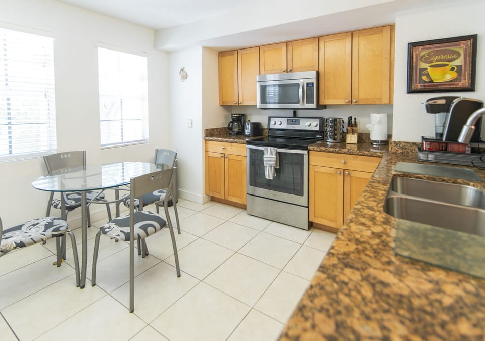 2nd floor full kitchen is located next to dining table & close to all the fun.