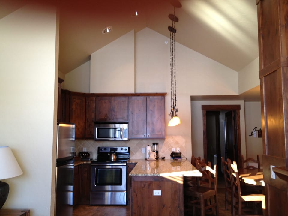 Vaulted ceilings open up the kitchen and living areas!!