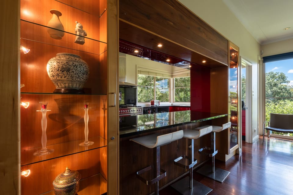 Dantosa House Kitchen servery bar with display cabinets.