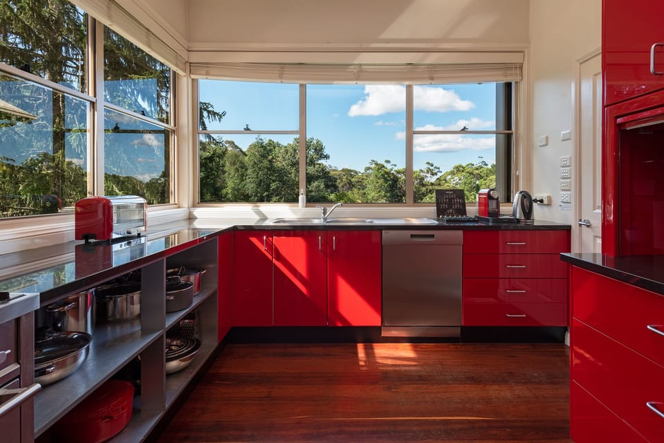 Dantosa House's fully equipped kitchen overlooking the gardens and lake.