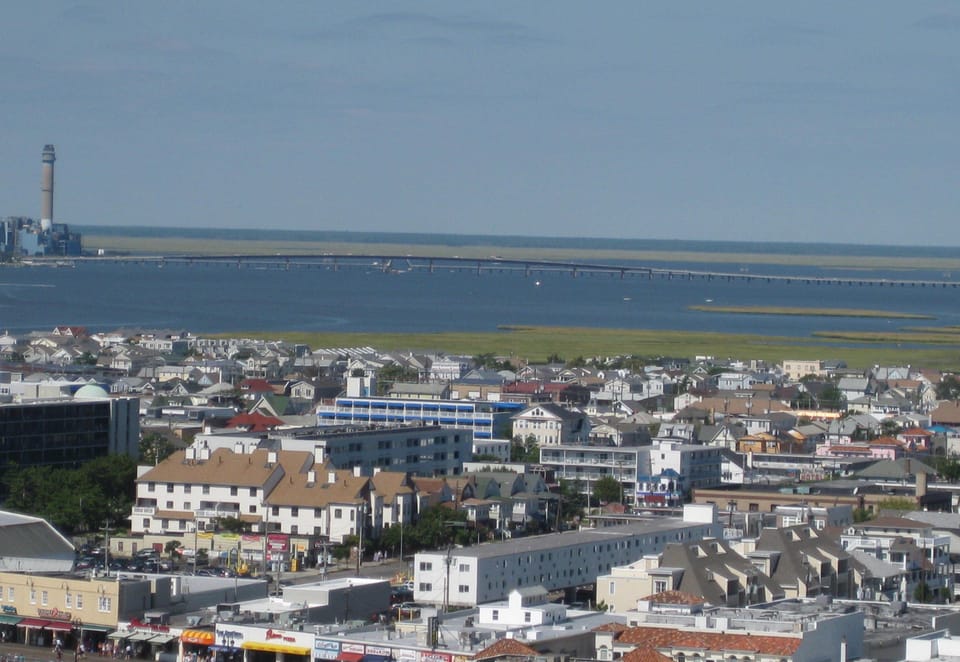 Follow street from left away from boardwalk. Our balcony is top floor above tree