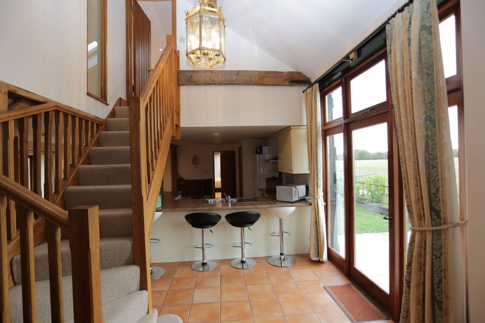 Wrap around bar with stools.  There is also a large table seating 8 guests.