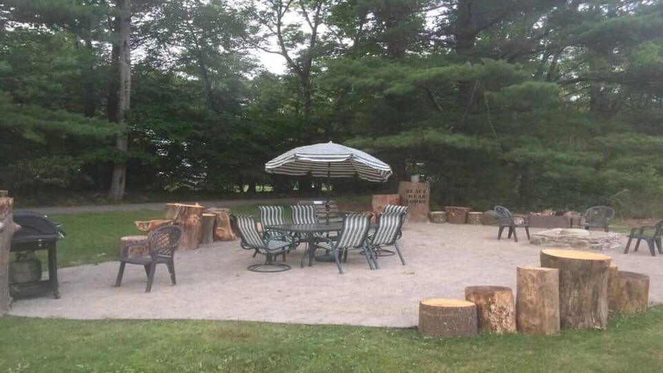 Everyone’s favorite spot!! Fire pit, charcoal and gas grills, and dining table!