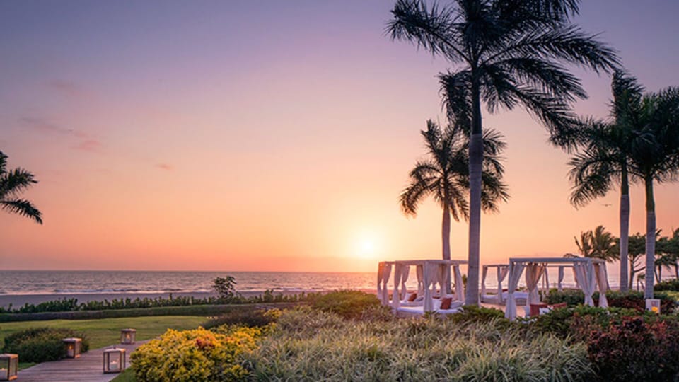 Catch the sunset from your own cabana