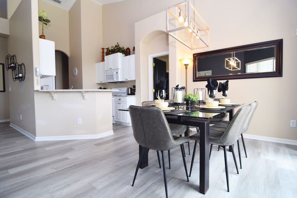 Beautiful formal dining area with views to the pool deck