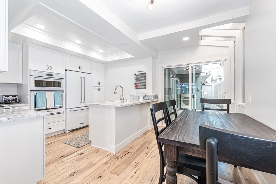 The kitchen opens out to the dining area, making meal prep a social affair!
                