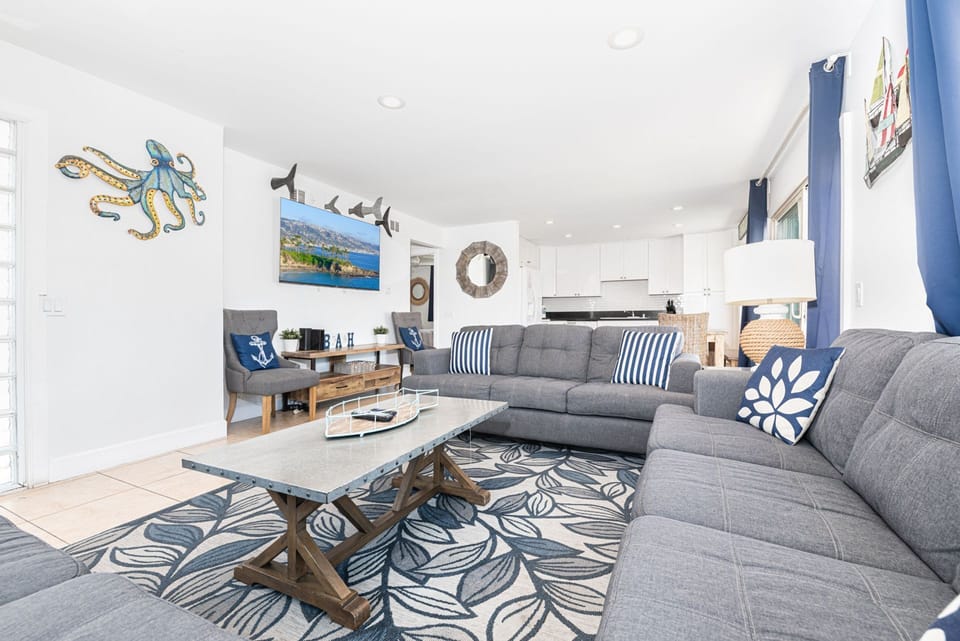 With plenty of natural light and beachy touches, this home will sweep you off your feet and into vacation mode!
                