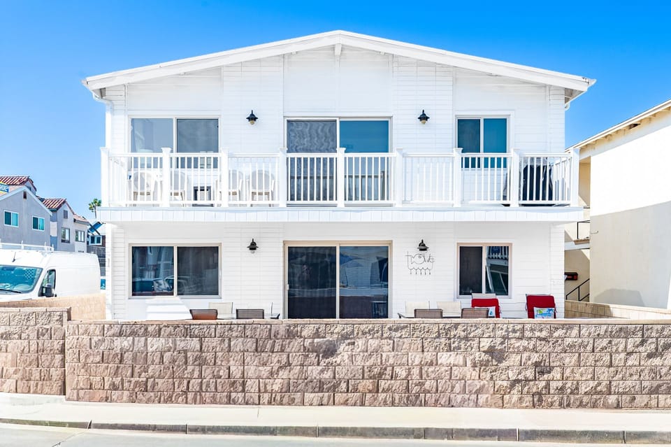 Situated on a corner lot and just one home from the sand, this listing pertains to the upper unit only. The lower 3bed/3ba can be booked simultaneously when available.
                