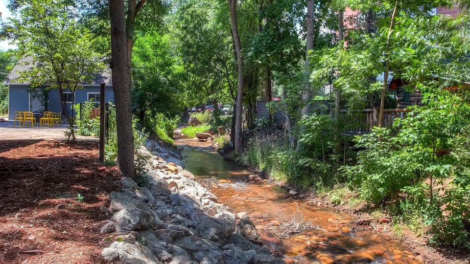 Creek side setting. Firepit, Adirondack chairs, bistro dining for 8, BBQ grill