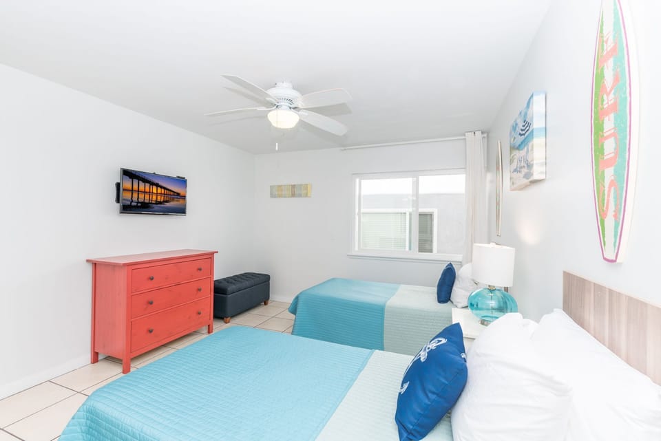 Airy and welcoming, this guest room offers plenty of space to unwind
                