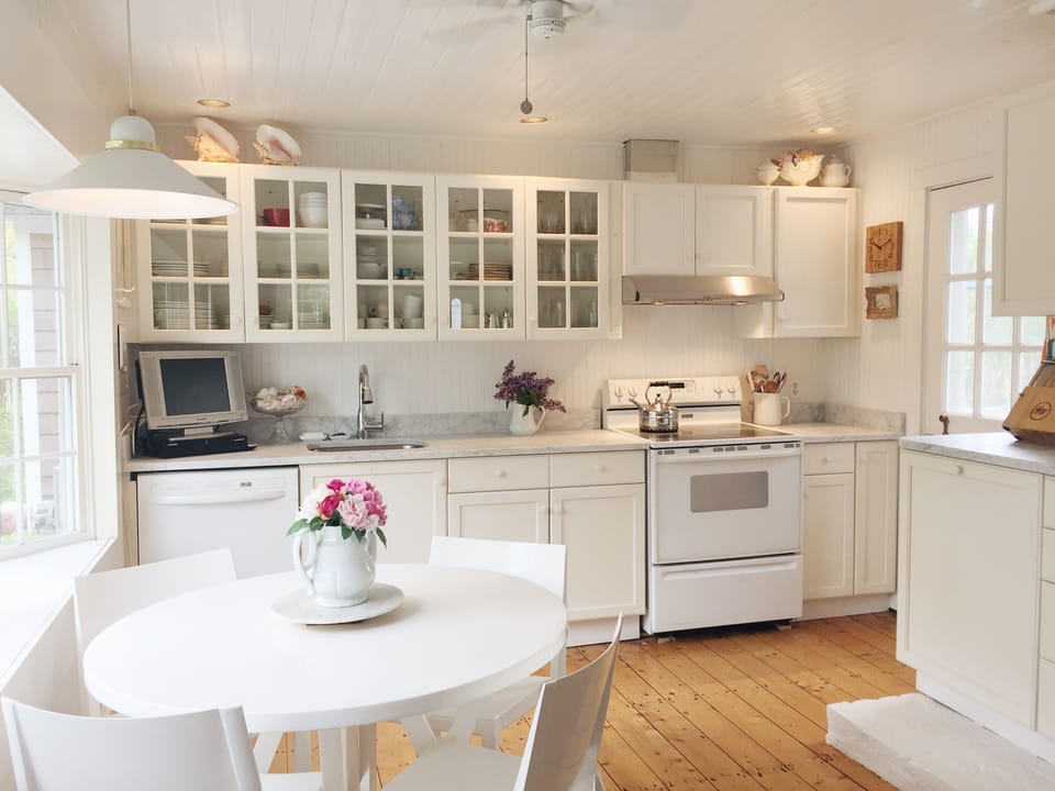 Newly updated kitchen with white marble countertops and great natural light